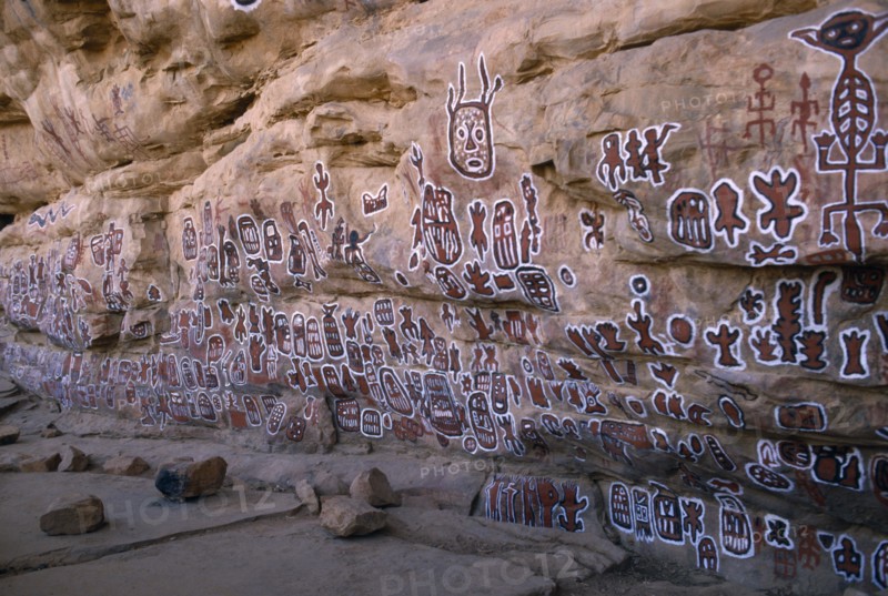 MALI, Bandiagara Escarpment, Dogon rock paintings at sacred site of circumcision rituals which take place every three years.  Each new initiate adds his own personal symbol.
