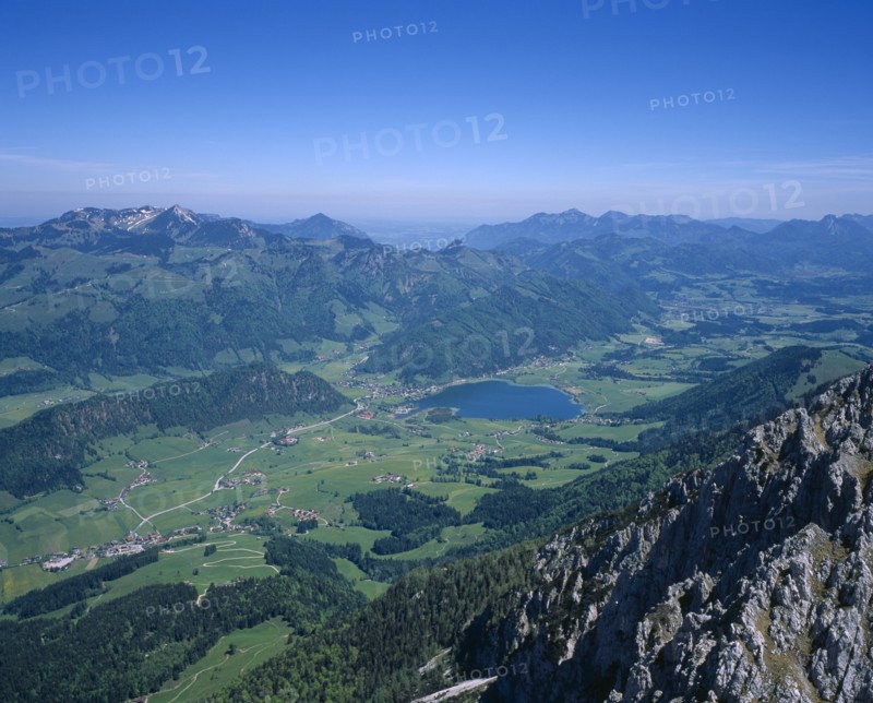 AUSTRIA, Pyramidenspitze, Kaisergebirge Mountains, "View North East from summit, Walchseed village in distant valley with lake."