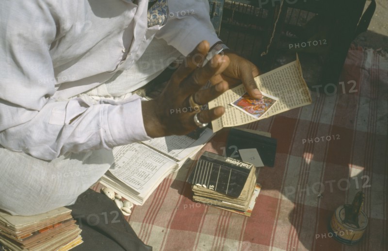 INDIA, Maharashtra, Pune, Cropped view of fortune teller.