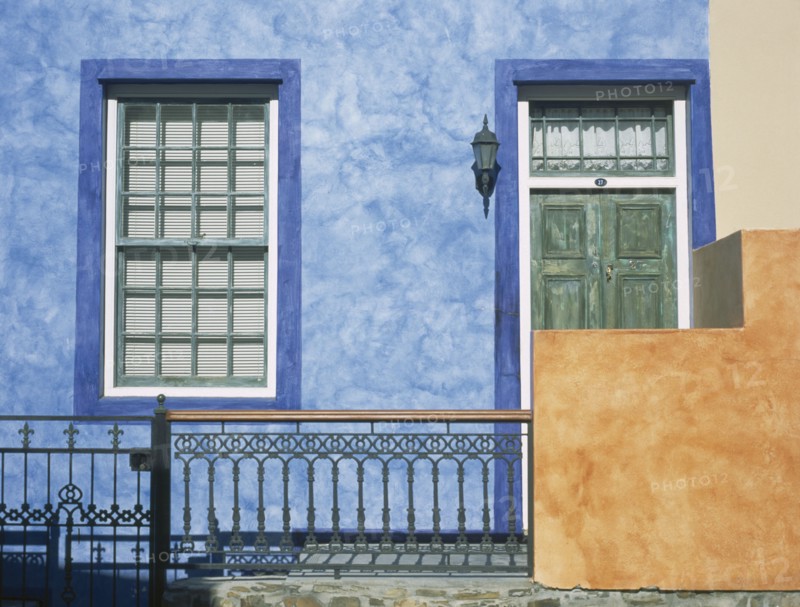 SOUTH AFRICA, Western Cape, Cape Town, Bo Kapp District. Chiappini Street. Brightly painted house frontage with detail of the doors and windows in an area famous for its colourful architecture.