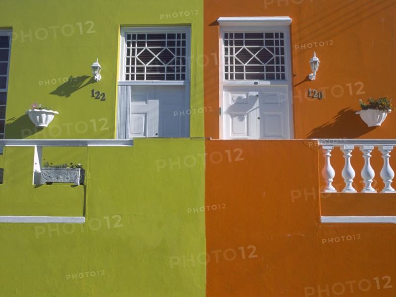 SOUTH AFRICA, Western Cape, Cape Town, Bo Kapp District. Chiappini Street. Brightly painted houses joined together with detail of doors.