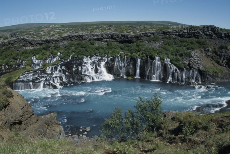 ICELAND, Borgarfjordur, Hraunfossar Falls on the Hvita River. Water comes from beneath Hallmundarhraun lava field.