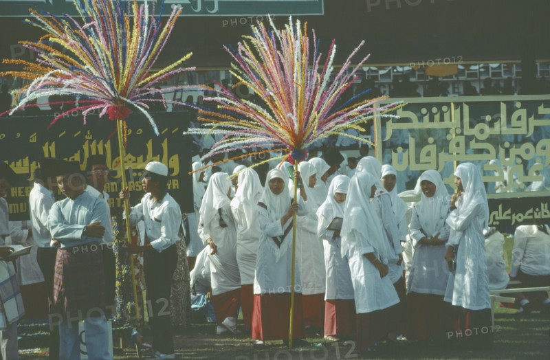 BRUNEI, Bandar Seri Begawan, Women in procession as part of the celebrations for Mohamed’s birthday.