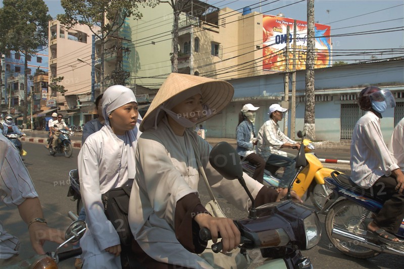VIETNAM, South, Ho Chi Minh City, Buddhist monks riding a motorbike