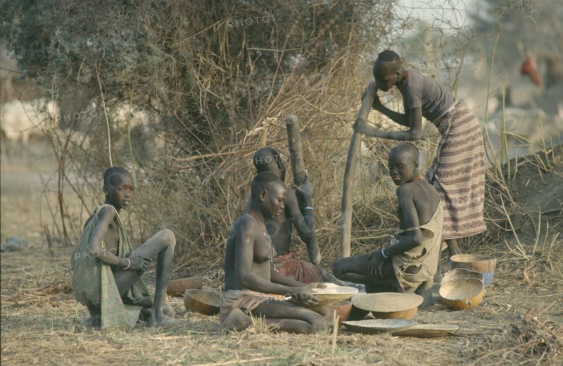 SUDAN, Agriculture, Dinka women pounding millet.