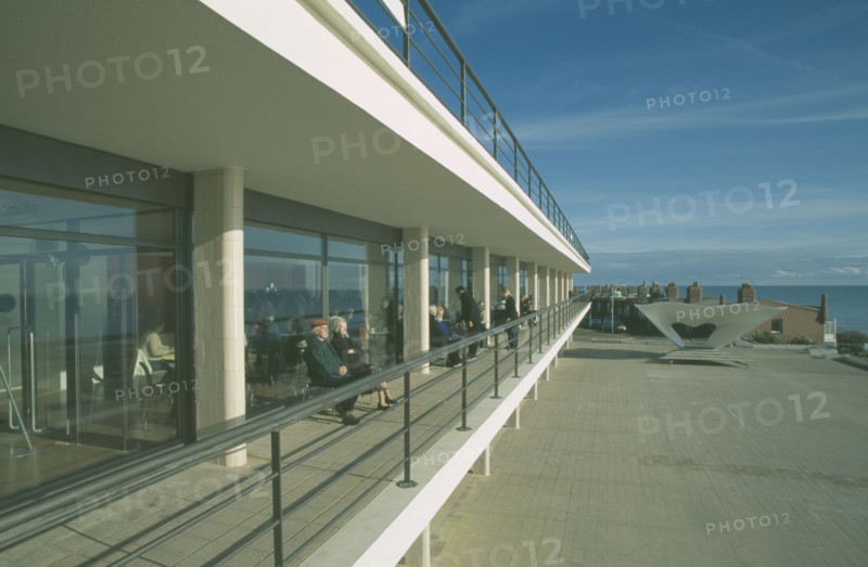 ENGLAND, East Sussex, Bexhill on Sea, De La Warr Pavilion. Exterior view of visitors on balcony terrace.