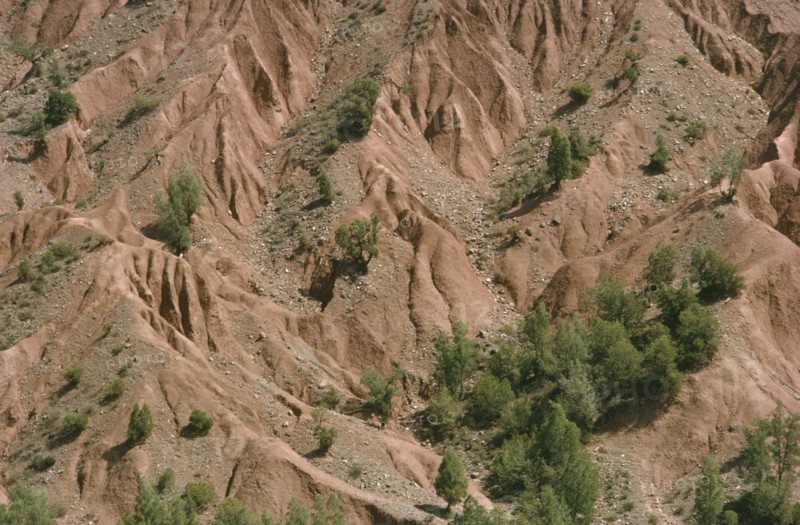 MOROCCO, High Atlas Mountains, Aerial view over eroded rock and scree slopes.