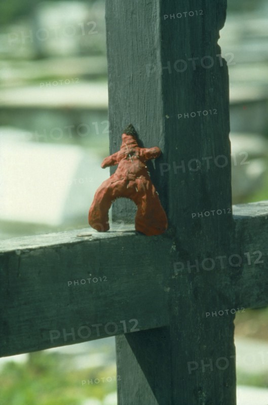 HAITI, Voodoo, Pins stuck in the heart of a voodoo doll in graveyard.