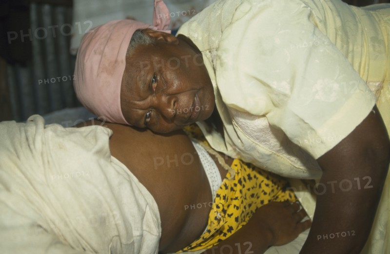 MAURITIUS, Rodrigues Island, Seventy year old traditional birth attendant listening to foetal heart.