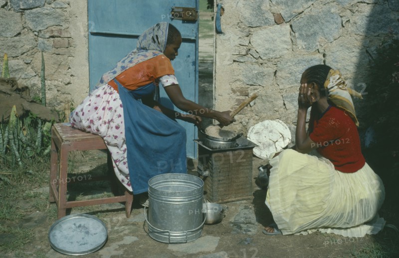 ERITREA, AFABET, Women cooking over charcoal.