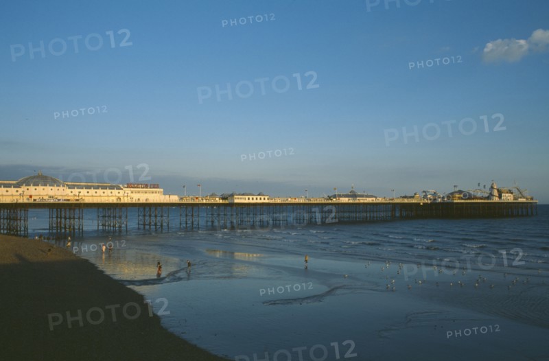 ENGLAND, East Sussex, Brighton, Brighton Pier in early evening light.