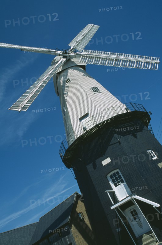 ENGLAND, Kent, Cranbrook, Angled view of Windmill museum. Union Mill is a white weatherboarded smock mill. It is the tallest mill in Kent at 70 ft