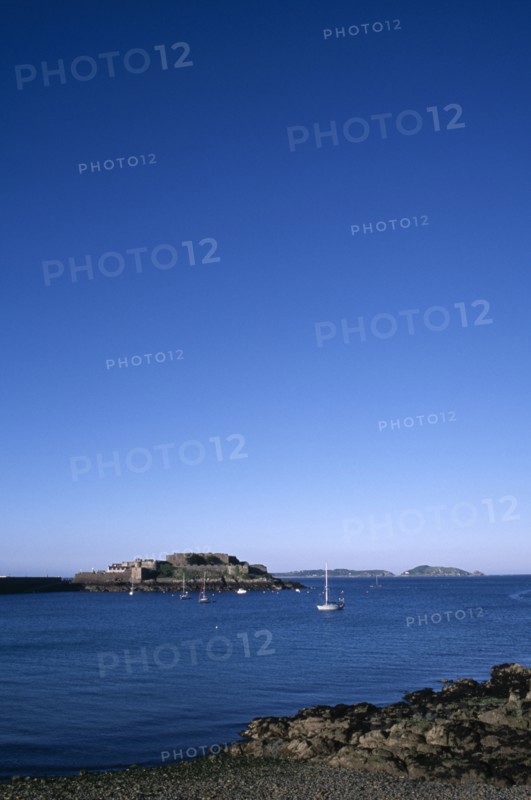 UNITED KINGDOM, Channel Islands, Guernsey, St Peter port. Castle Cornet seen from across water.