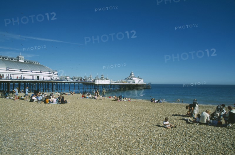 ENGLAND, East Sussex, Eastbourne, View from occupied shingle beach towards Pier