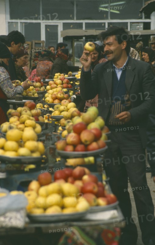 RUSSIA, Dagestan, Derbent, Fruit sellers at market.