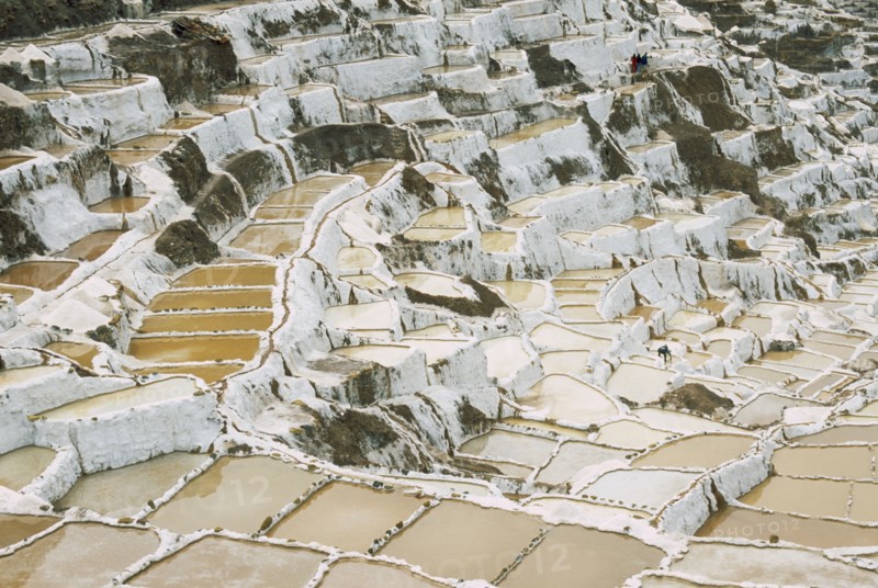 PERU, Cusco, Salineras, People working on the Salt Mines dating back to Inca times. Near Urubamba.