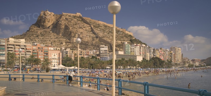 SPAIN, The Costa Blanca, Alicante. , Playa del Postiguet with Castillo de Santa Barbera rising behind.