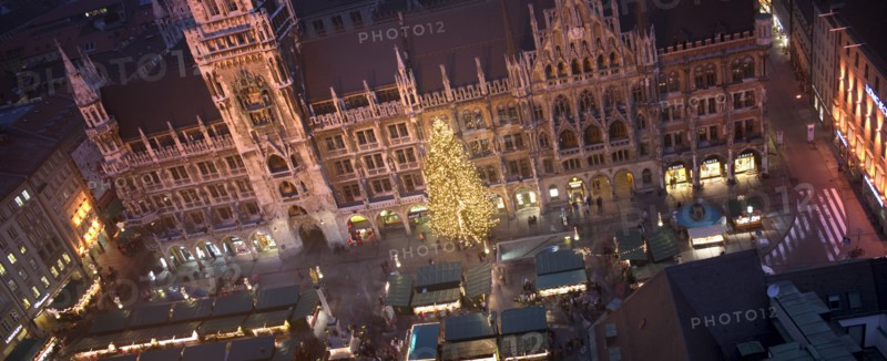GERMANY, Bavaria, Munich, Panoramic view of the Christmas Market beneath the Rathaus.