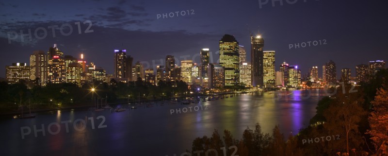 AUSTRALIA, Queensland, Brisbane, Panoramic view of the city across the Brisbane River as dusk falls.