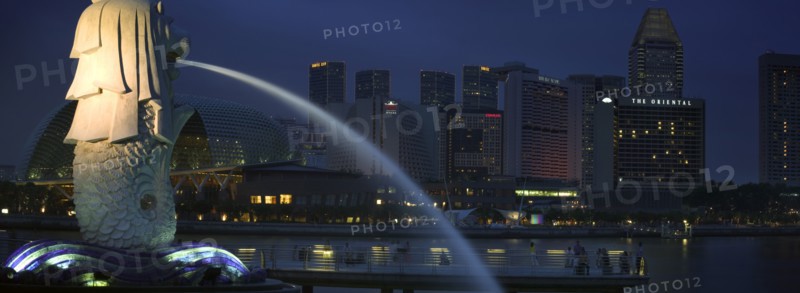 SINGAPORE, Merlion Statue, Night time view of the Esplanade - Theatres on the Bay complex from Merlion Park.