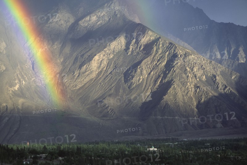 PAKISTAN, North West Frontier Province, Skardu, "Rainbow, with mosque lit up by sun."