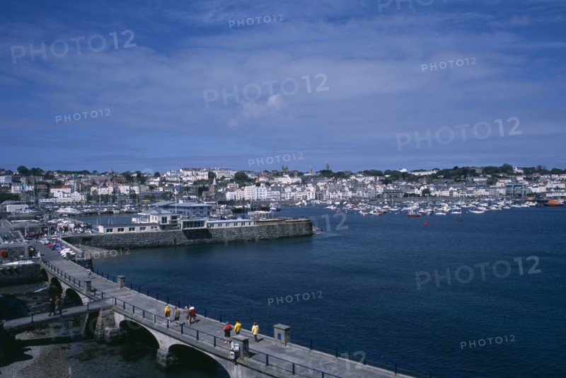 UNITED KINGDOM, Channel Islands, Guernsey, St Peter Port. View from Castle Cornet towards marina and quayside buildings.