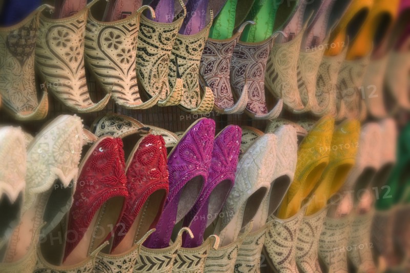 UAE, Dubai, Side view of colourful traditional Arab footware for sale in Old Souk.