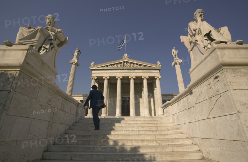 GREECE, Central, Athens, A lady walking up the steps leading to the Numismatic Museum.