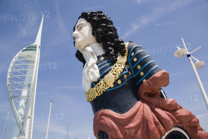 ENGLAND, Hampshire, Portsmouth, The Spinnaker Tower the tallest public viewing platforn in the UK at 170 metres on Gunwharf Quay with old ships bowspit figurehead in the foreground