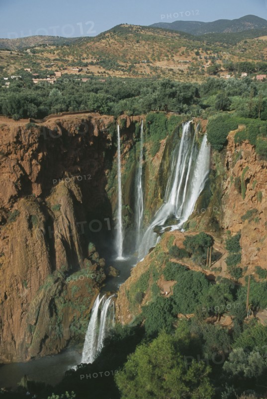 MOROCCO, Middle Atlas, Cascades d’Ouzoud, Waterfalls of the Olives.  Multiple falls cascading over rocks into natural pools.
