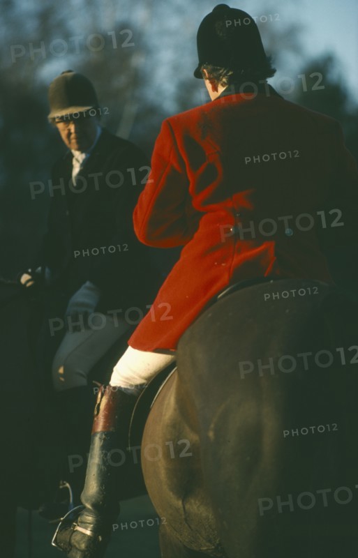 SPORT, Equestrian, Foxhunting, Riders on horseback with male rider wearing traditional red coat also known as hunting pink.