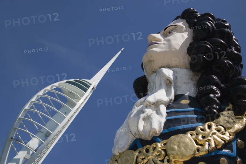 ENGLAND, Hampshire, Portsmouth, The Spinnaker Tower the tallest public viewing platforn in the UK at 170 metres on Gunwharf Quay with old ships bowspit figurehead in the foreground