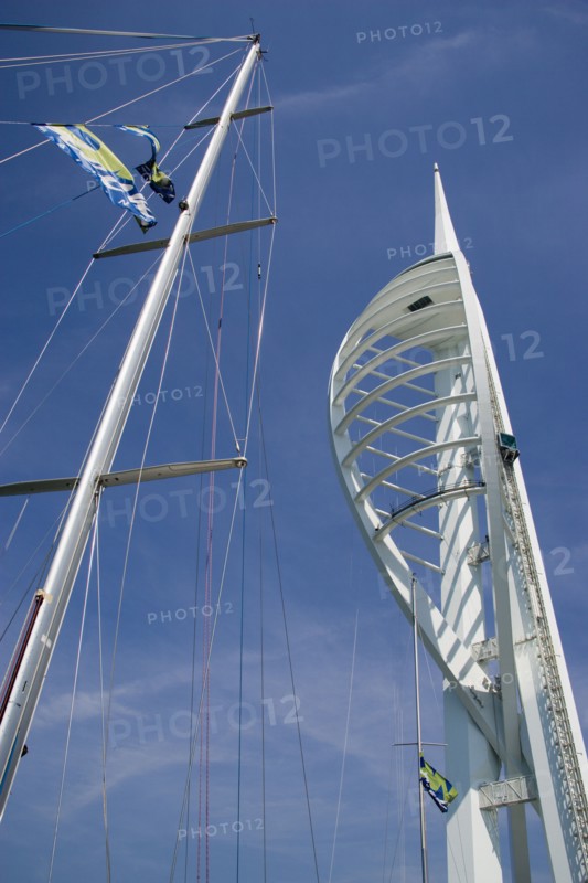 ENGLAND, Hampshire, Portsmouth, The Spinnaker Tower the tallest public viewing platforn in the UK at 170 metres on Gunwharf Quay with yachts mast in the foreground