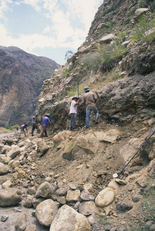 PERU, Cordillera Balnca, Huaraz, Workers clearing a land slide.