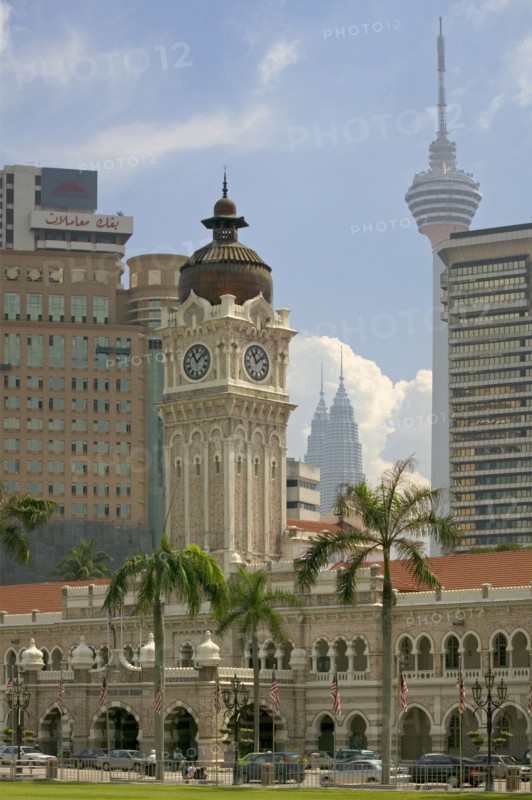 MALAYSIA, Peninsular, Kuala Lumpur,  View of The Sultan Abdul Samad Building from Merdeka Square with KL Tower and The Petronis Towers behind.