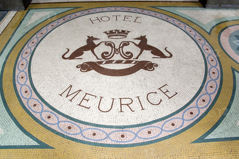 FRANCE, Ile de France, Paris, A mosaic with a crest and the words Hotel Meurice on the pavement outside the entrance door to the five star hotel in the Rue de Rivoli