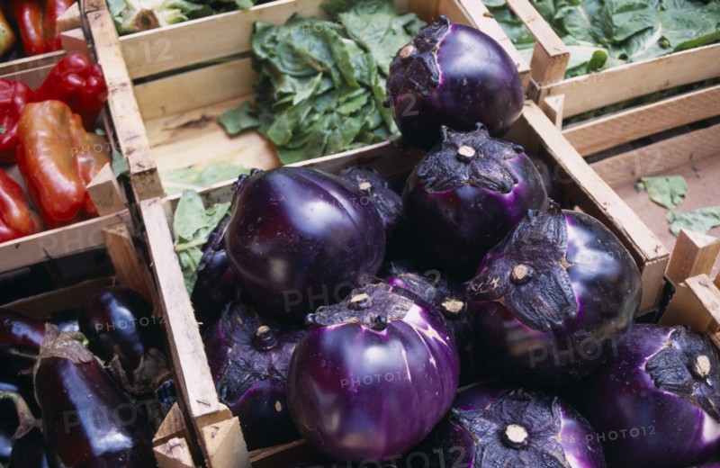 ITALY, Sicily, Palermo, La Vecciria Market. Fresh vegetables on market stall with detail of aubergines in wooden crates