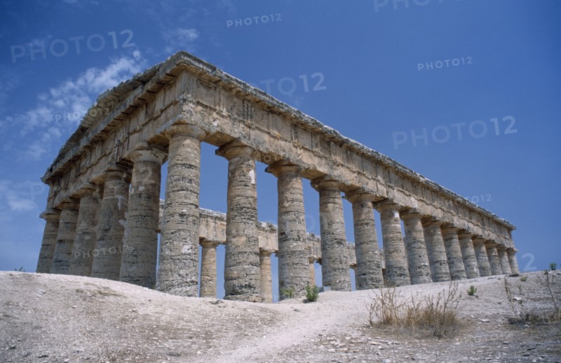 ITALY, Sicily, Trapani, Segesta. Doric Temple. Ruins of the ancient city with view of hexastyle colonnaded structure