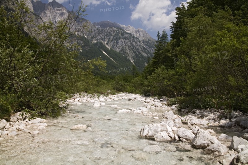 SLOVENIA , Triglav National Park, Julian Mountain Range, Looking along the Vrata Valley the longest valley in Slovenia - The River Bristica springs from the gravel at the foot of the mountain
