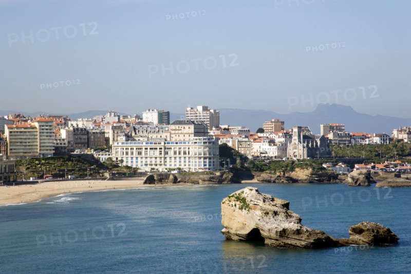 FRANCE, Aquitaine Pyrenees Atlantique, Biarritz, The Basque seaside resort on the Atlantic coast. The Grande Plage with the Bellevue Conference Centre in the middle and the Pyrenees mountains in the distance.
