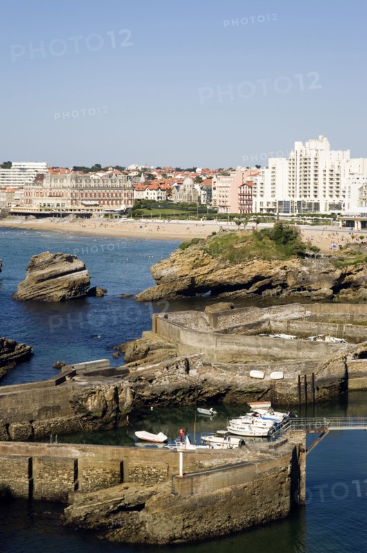 FRANCE, Aquitaine Pyrenees Atlantique, Biarritz, The Basque seaside resort on the Atlantic coast. Boats in the safe harbour of the Port des Pecheurs with the Grande Plage and town beyond