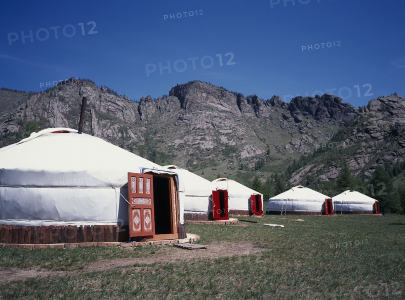 MONGOLIA, Architecture, Line of gers near in rocky landscape near Terelj.