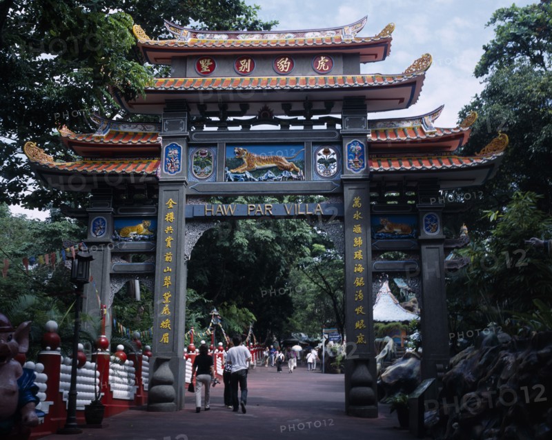 SINGAPORE, Haw Par Villa, Entrance to Haw Par Villa and Tiger Balm Gardens with people walking through below.