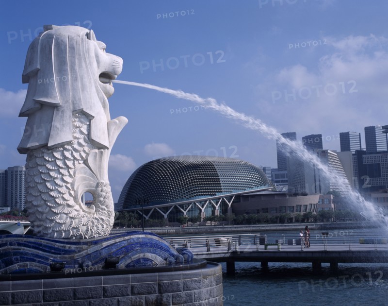 SINGAPORE, Merlion Park, Merlion statue and fountain in foreground with new esplanade concert hall behind.