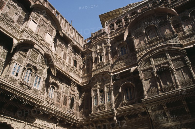 INDIA, Rajasthan, Jaisalmer, Patwon-ki-Haveli 1800-1860.  Sandstone house of wealthy merchant.  Part view of highly decorated exterior facade.