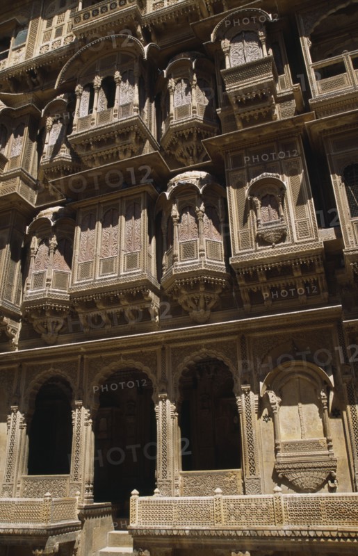 INDIA, Rajasthan, Jaisalmer, Patwon-ki-Haveli 1800-1860.  Sandstone house of wealthy merchant.  Part view of highly decorated exterior facade.