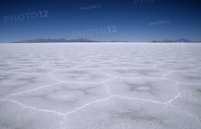 BOLIVIA, Potosi, Salar de Uyuni, Flat expanse of salt lake patterned with hexagonal shapes.