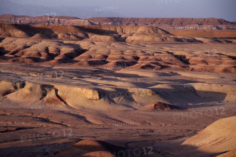 MOROCCO, Ait Benhaddou, Wind eroded desert landscape.