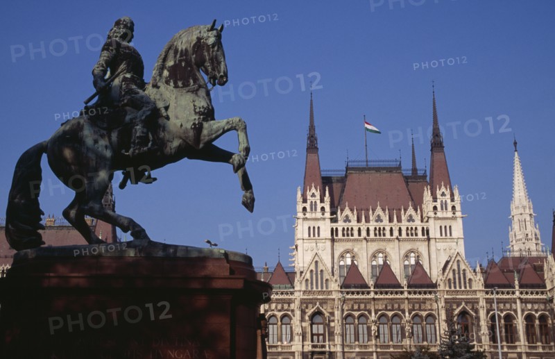 HUNGARY, Budapest, Parliament building with equestrian statue of Ferenc Rakoczi in foreground. Eastern Europe