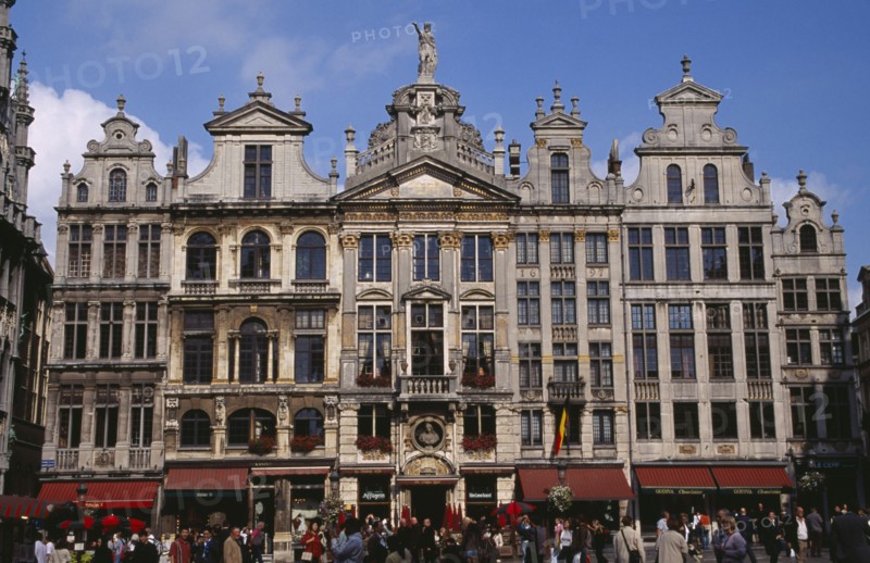 BELGIUM, Brabant, Brussels, Grand Place.  Crowds in front of old town buildings and cafes. UNESCO World Heritage Site